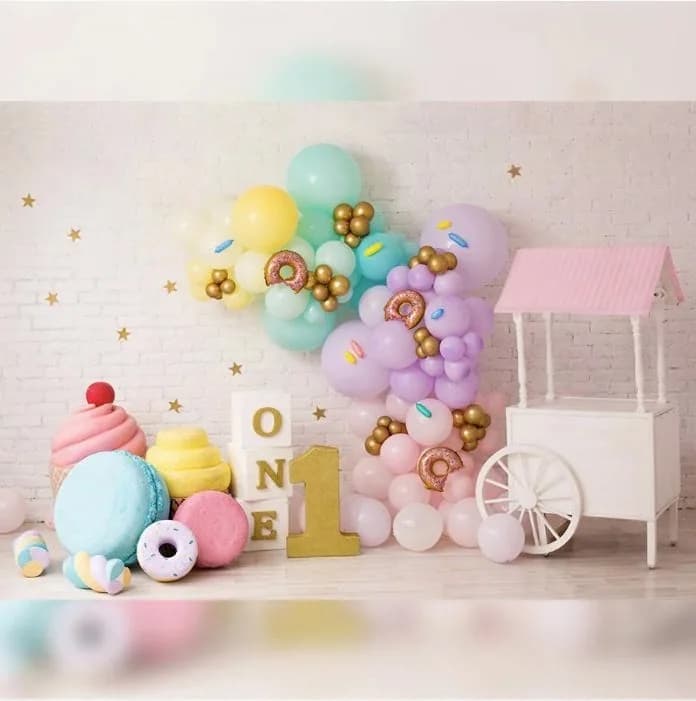 Candy Land backdrop with lollipops and bright sweets