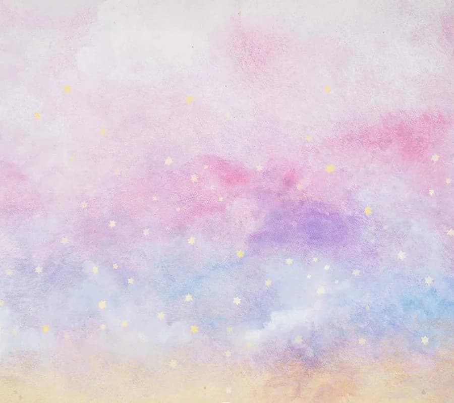 Unicorn Dreams backdrop with pastel clouds and a rainbow